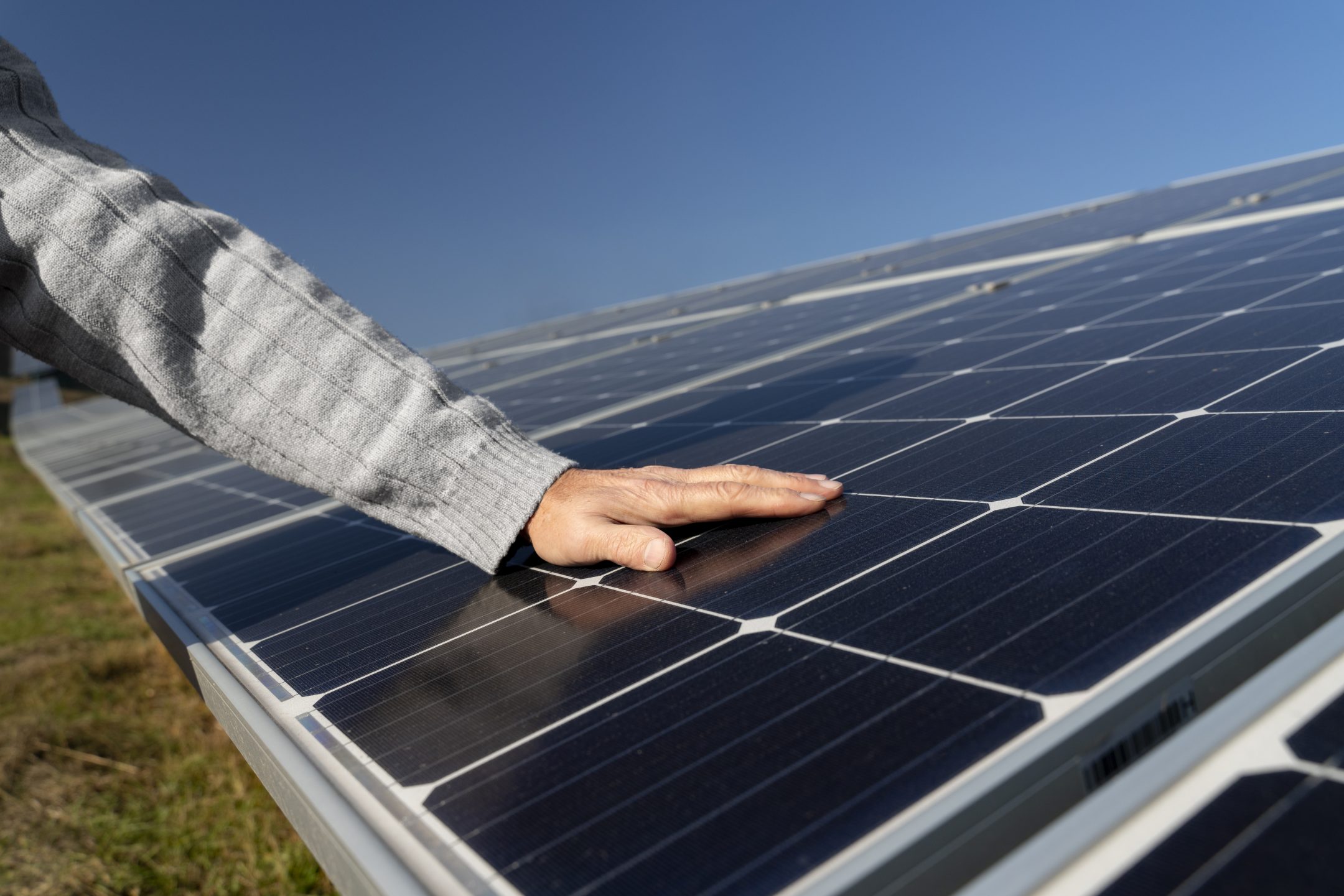 person near alternative energy plant