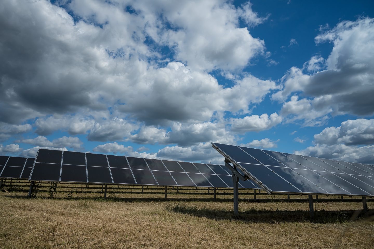 varwwwhtmlwp contentuploads202605solar panels used renewable energy field sky full clouds.jpg